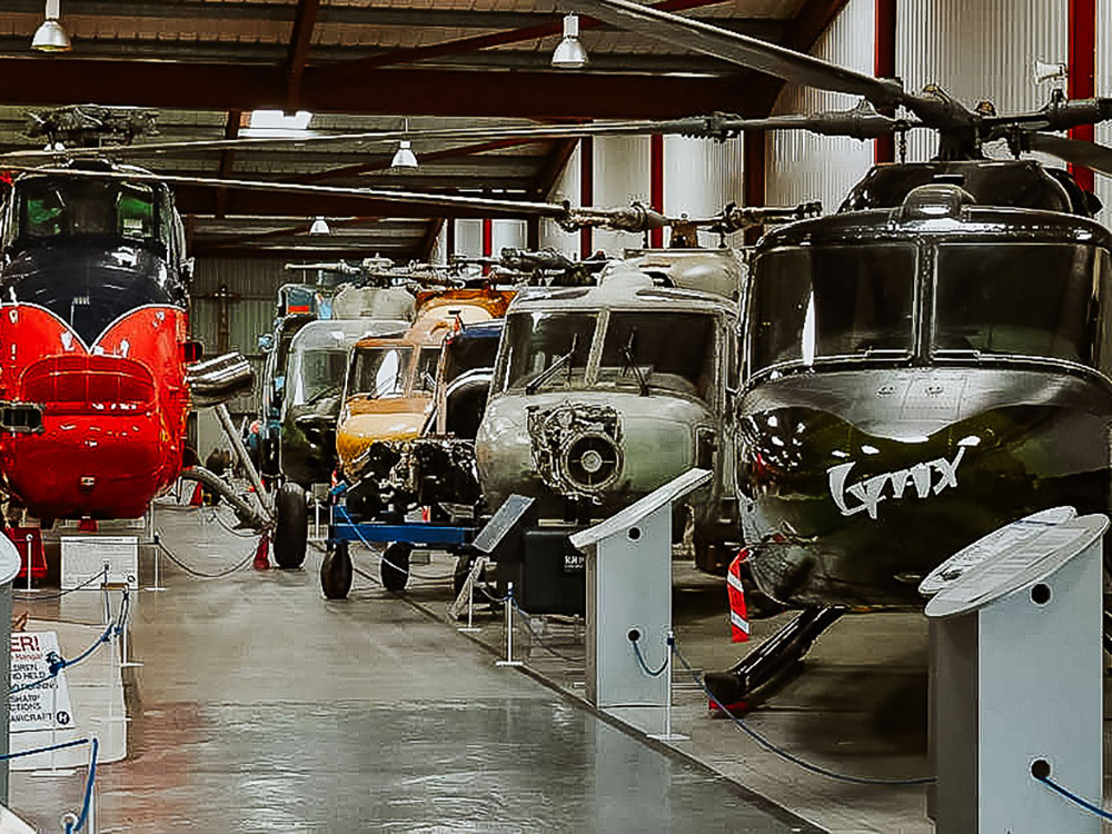 Helicopters lined up in a museum
